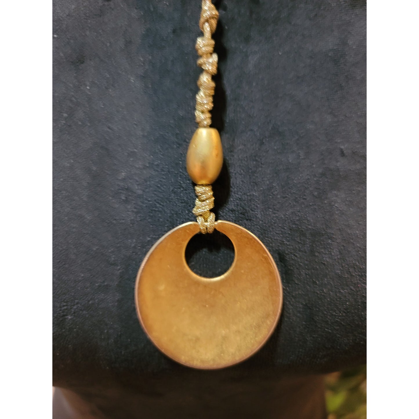 Women's Gold Circle Pendant Necklace with Braided Cord and Unique Bead Design
