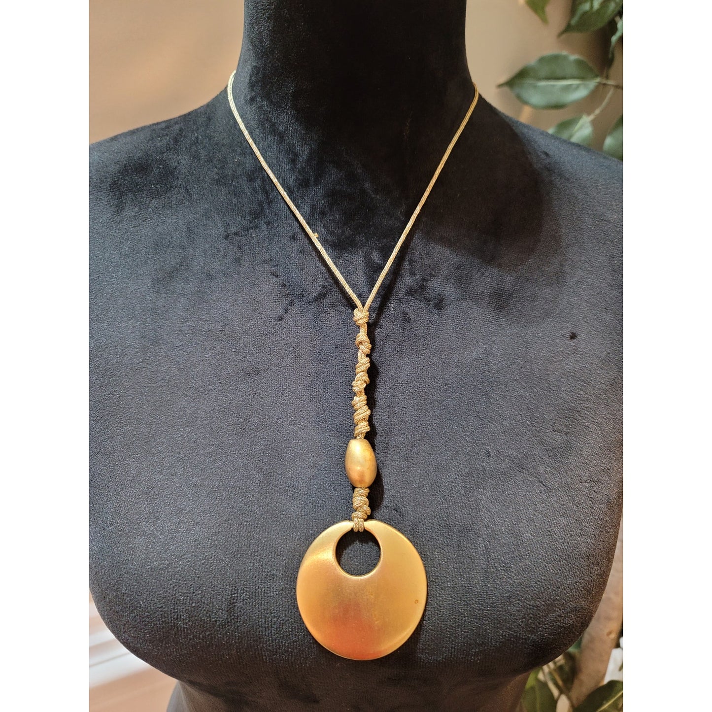 Women's Gold Circle Pendant Necklace with Braided Cord and Unique Bead Design