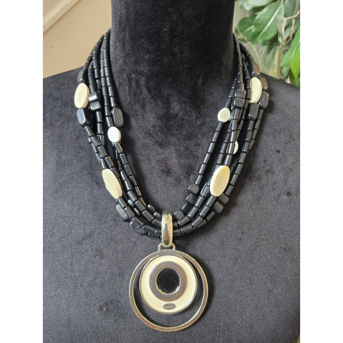 Black Multi Strand Gold Circle Pendant Necklace